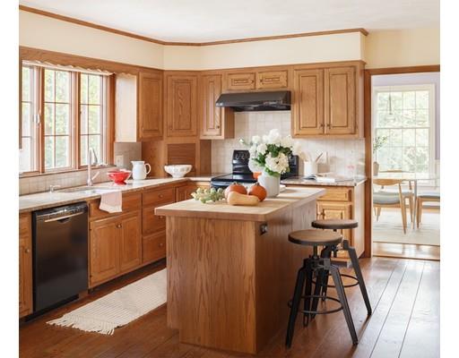 35 Louis Drive Wellesley, MA 02481 - Photo 4 of 14 a room with stainless steel appliances a kitchen island hardwood floor sink stove and view living room