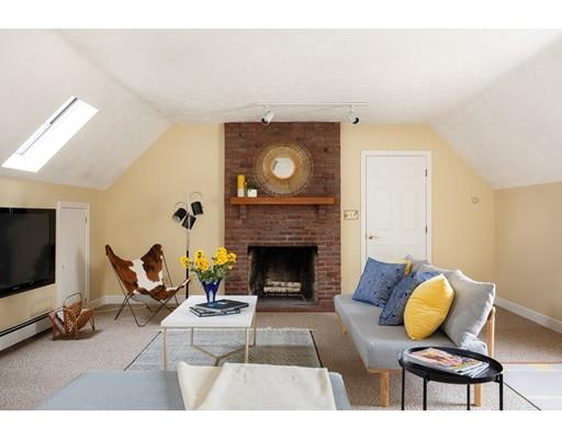 35 Louis Drive Wellesley, MA 02481 - Photo 6 of 14 a living room with furniture a flat screen tv and a fireplace