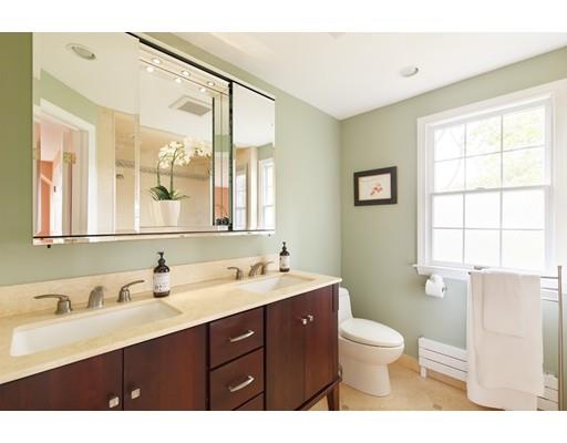35 Louis Drive Wellesley, MA 02481 - Photo 8 of 14 a bathroom with a double vanity sink toilet and a mirror