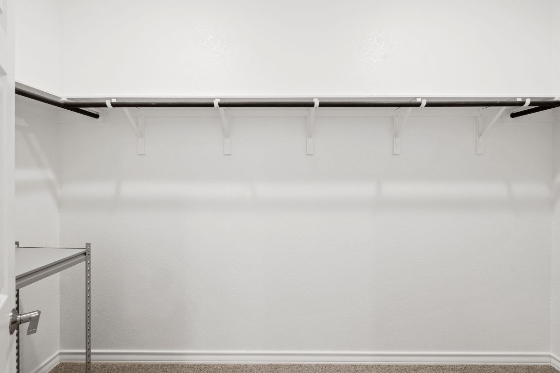 116 Thurman Holt Road Hutto, TX 78634 - Photo 11 of 35 Walk in closet with carpet