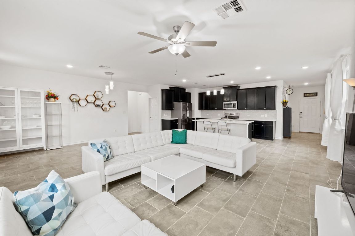 116 Thurman Holt Road Hutto, TX 78634 - Photo 15 of 35 Living area with recessed lighting and a ceiling fan
