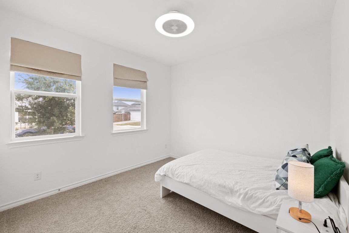 116 Thurman Holt Road Hutto, TX 78634 - Photo 20 of 35 Bedroom with carpet flooring and baseboards