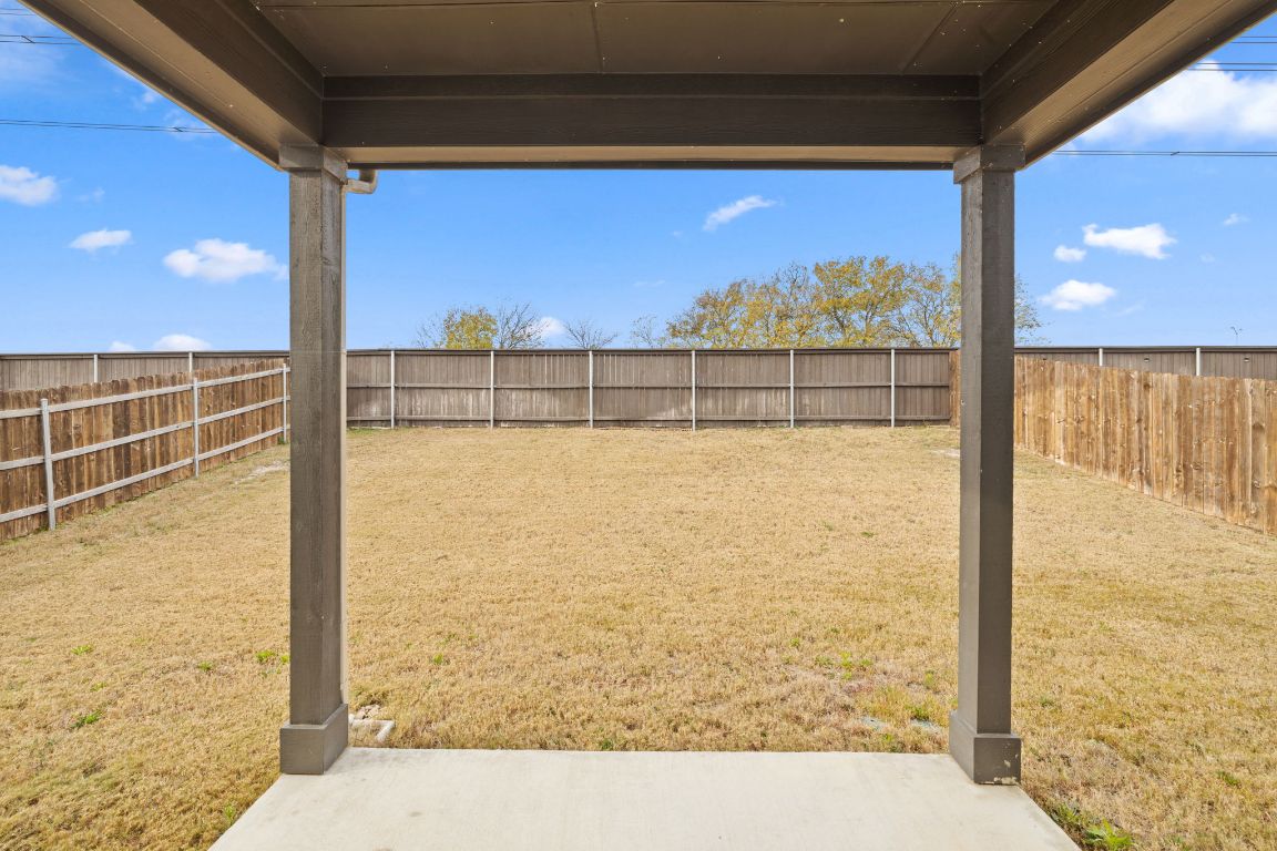 116 Thurman Holt Road Hutto, TX 78634 - Photo 29 of 35 Fenced backyard with a patio