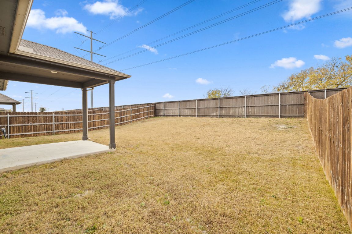 116 Thurman Holt Road Hutto, TX 78634 - Photo 31 of 35 Fenced backyard with a patio area