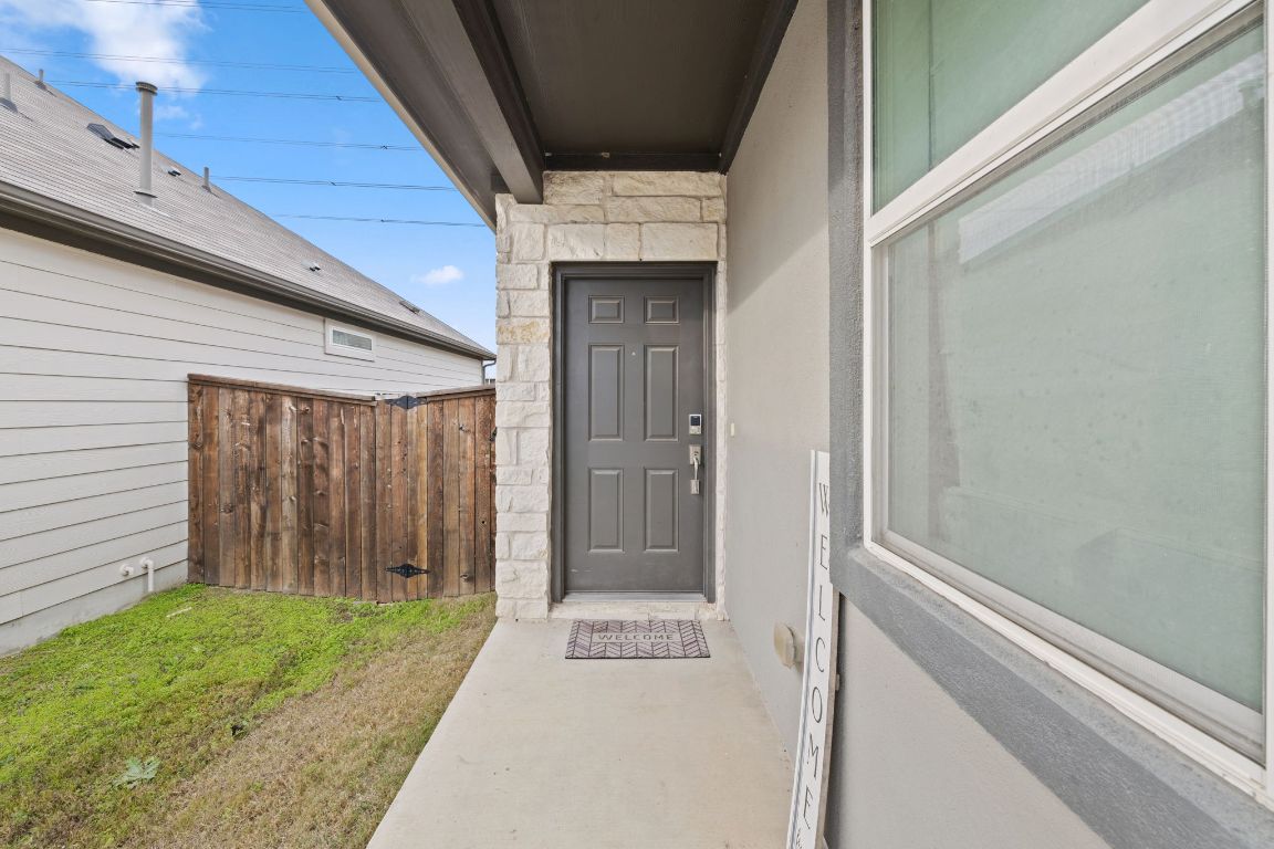 116 Thurman Holt Road Hutto, TX 78634 - Photo 4 of 35 Doorway to property with stone siding