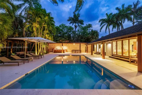 a view of a swimming pool with lounge chair
