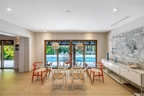 a kitchen with a table and chairs in it