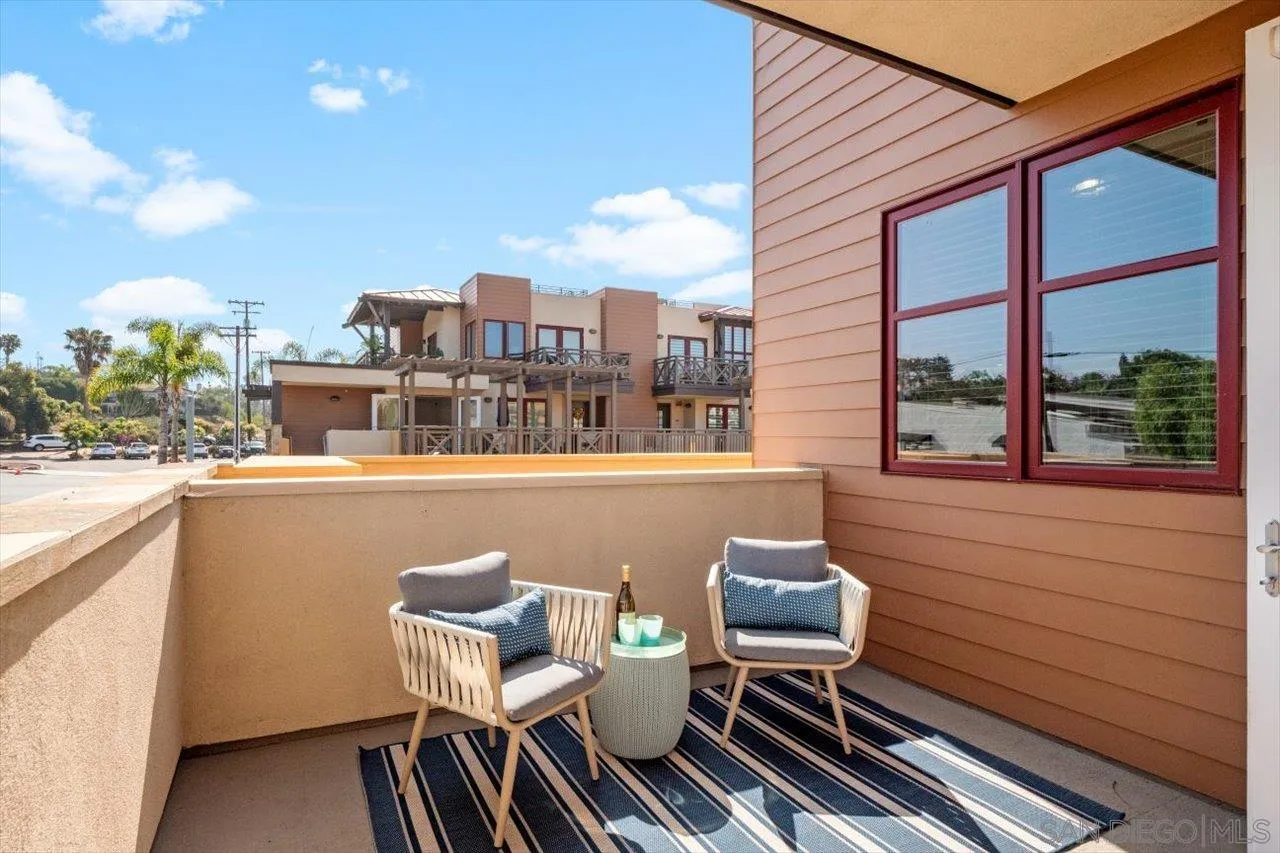 215 2nd Street, Unit 104 Encinitas, CA 92024 - Photo 15 of 22 a view of a chairs and table in a balcony