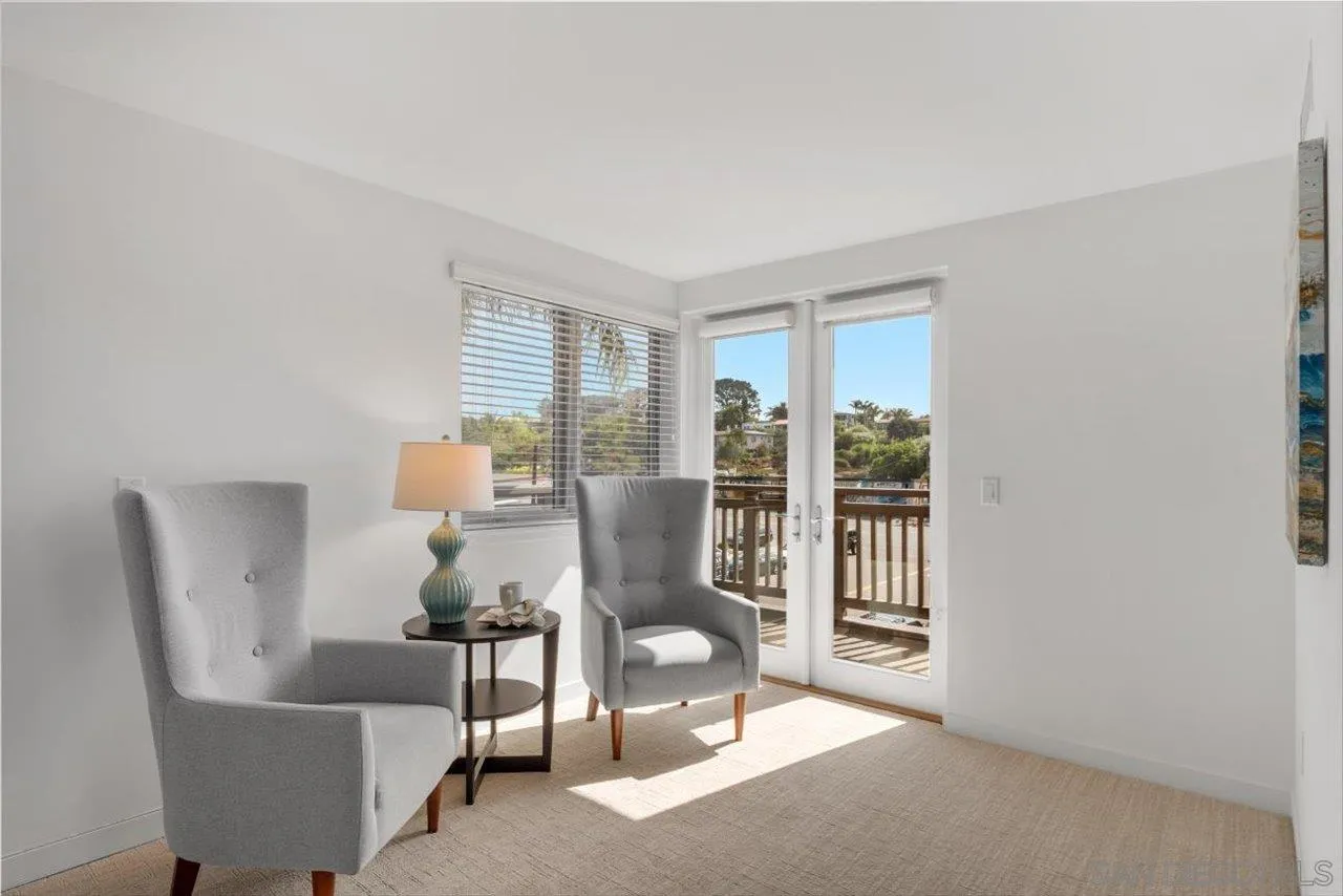 215 2nd Street, Unit 104 Encinitas, CA 92024 - Photo 18 of 22 a living room with furniture and a table