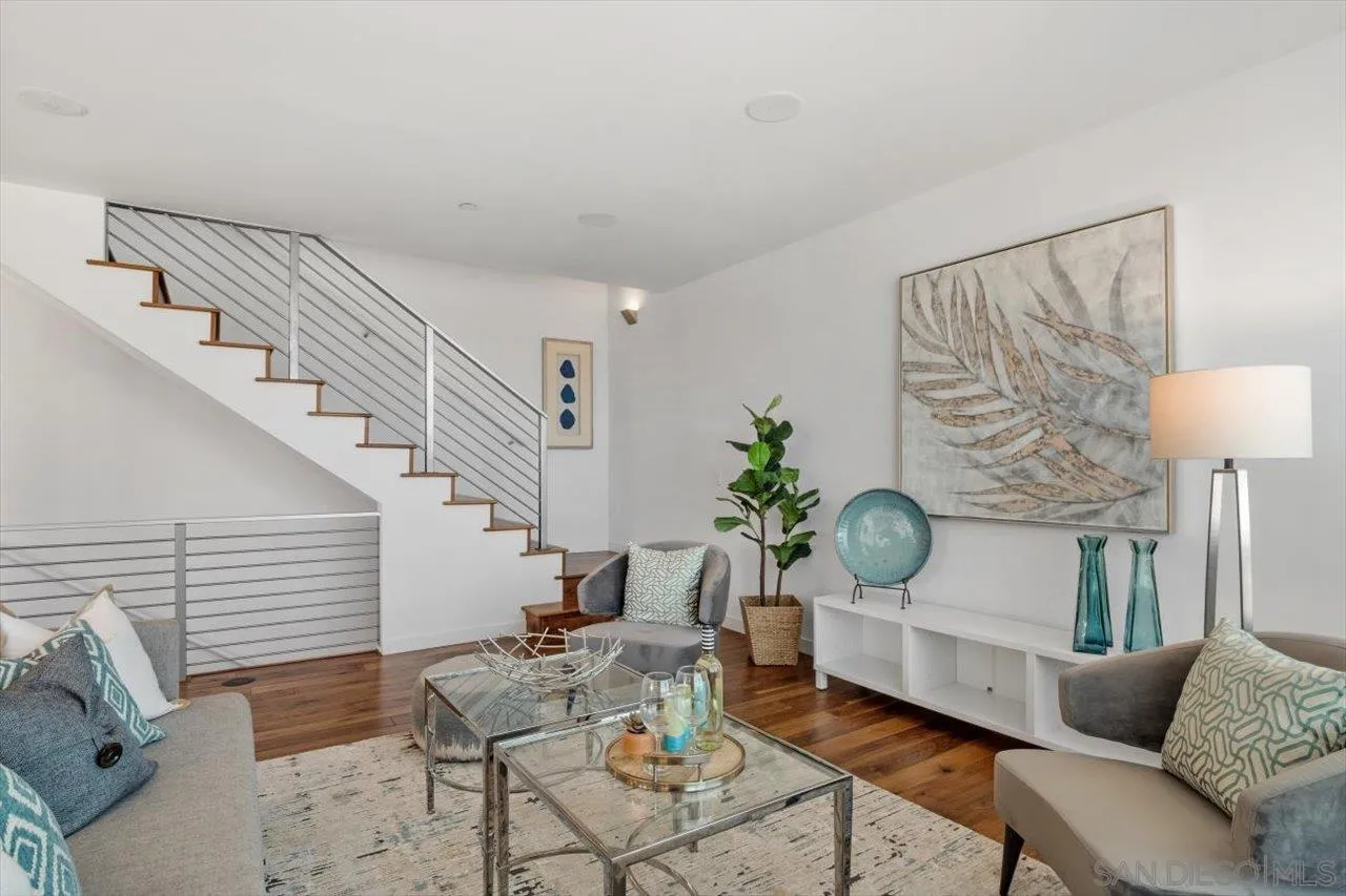 215 2nd Street, Unit 104 Encinitas, CA 92024 - Photo 8 of 22 a living room with furniture and a lamp
