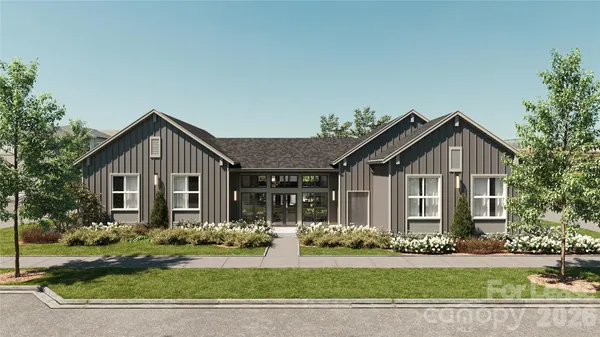 a bedroom with a bed and lamp