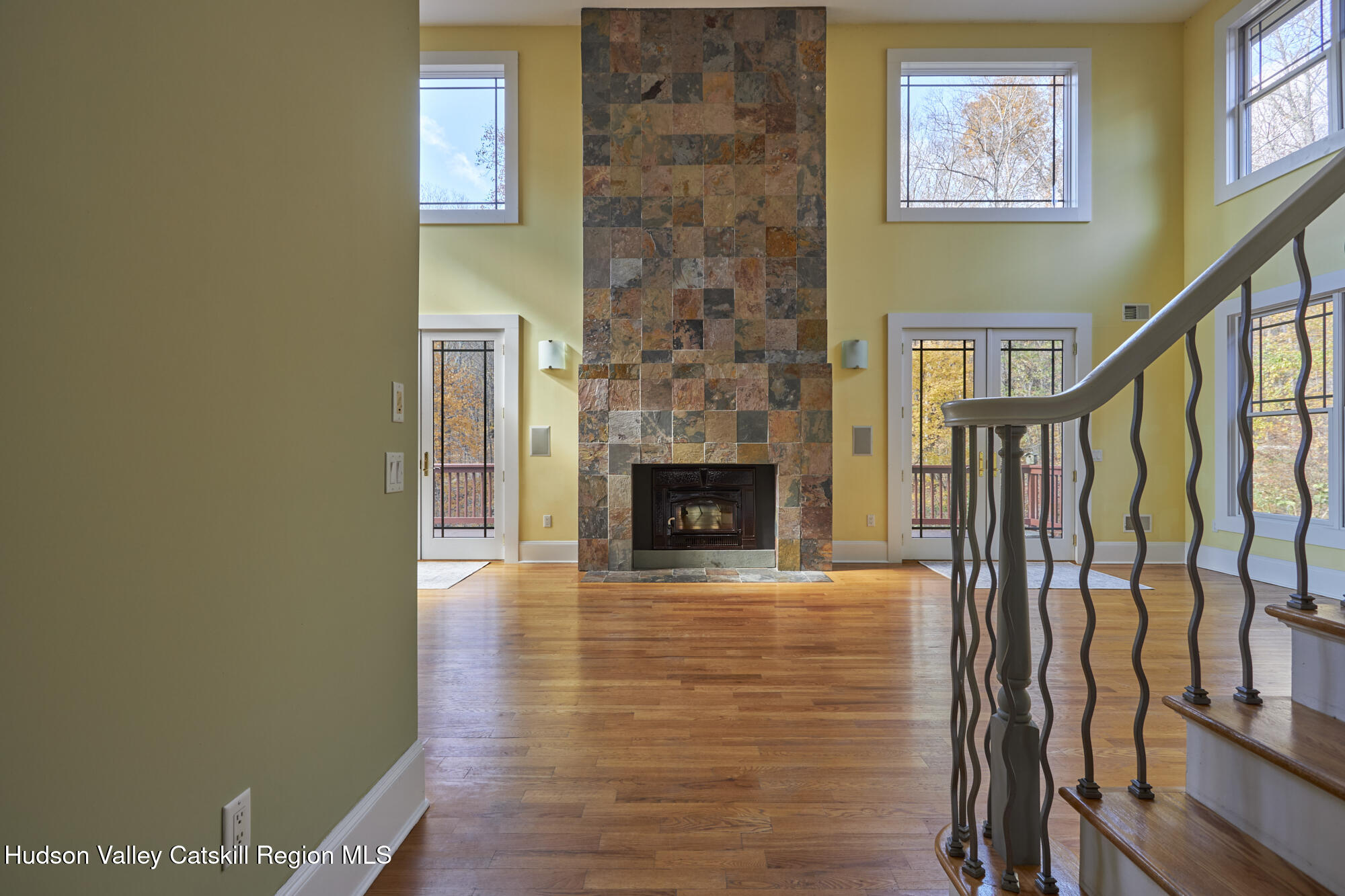 203 Silver Lake Road Rhinebeck, NY 12572 - Photo 11 of 46 a view of a livingroom with wooden floor and a fireplace