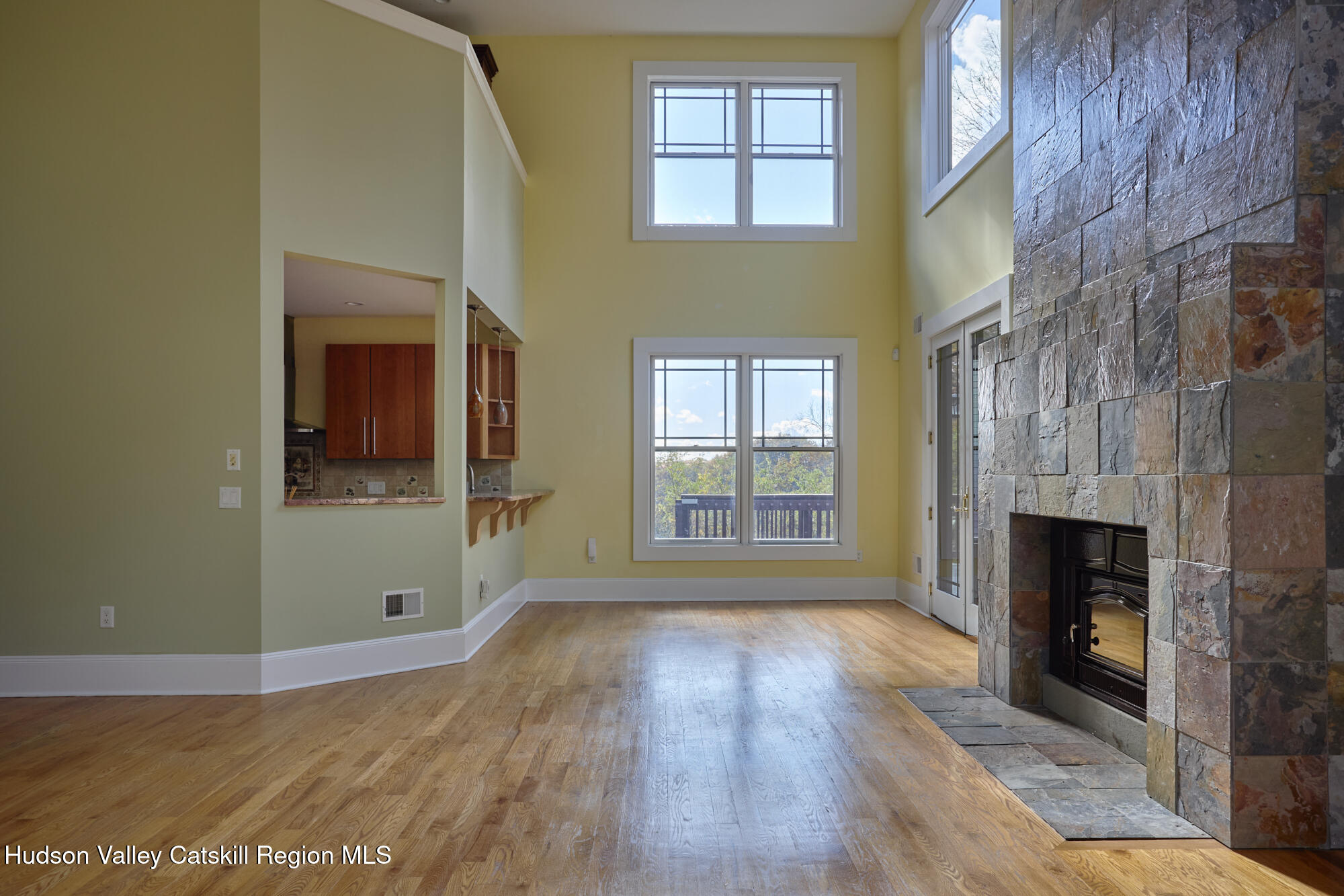 203 Silver Lake Road Rhinebeck, NY 12572 - Photo 15 of 46 a view of an empty room with wooden floor and a window