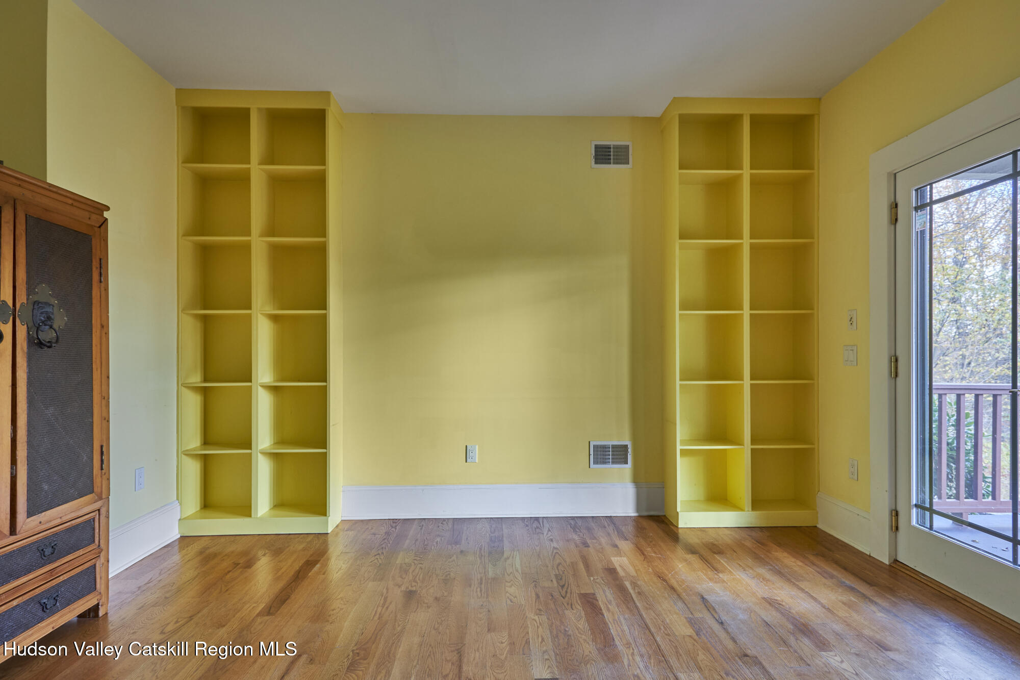 203 Silver Lake Road Rhinebeck, NY 12572 - Photo 18 of 46 a view of a room with wooden floor and door