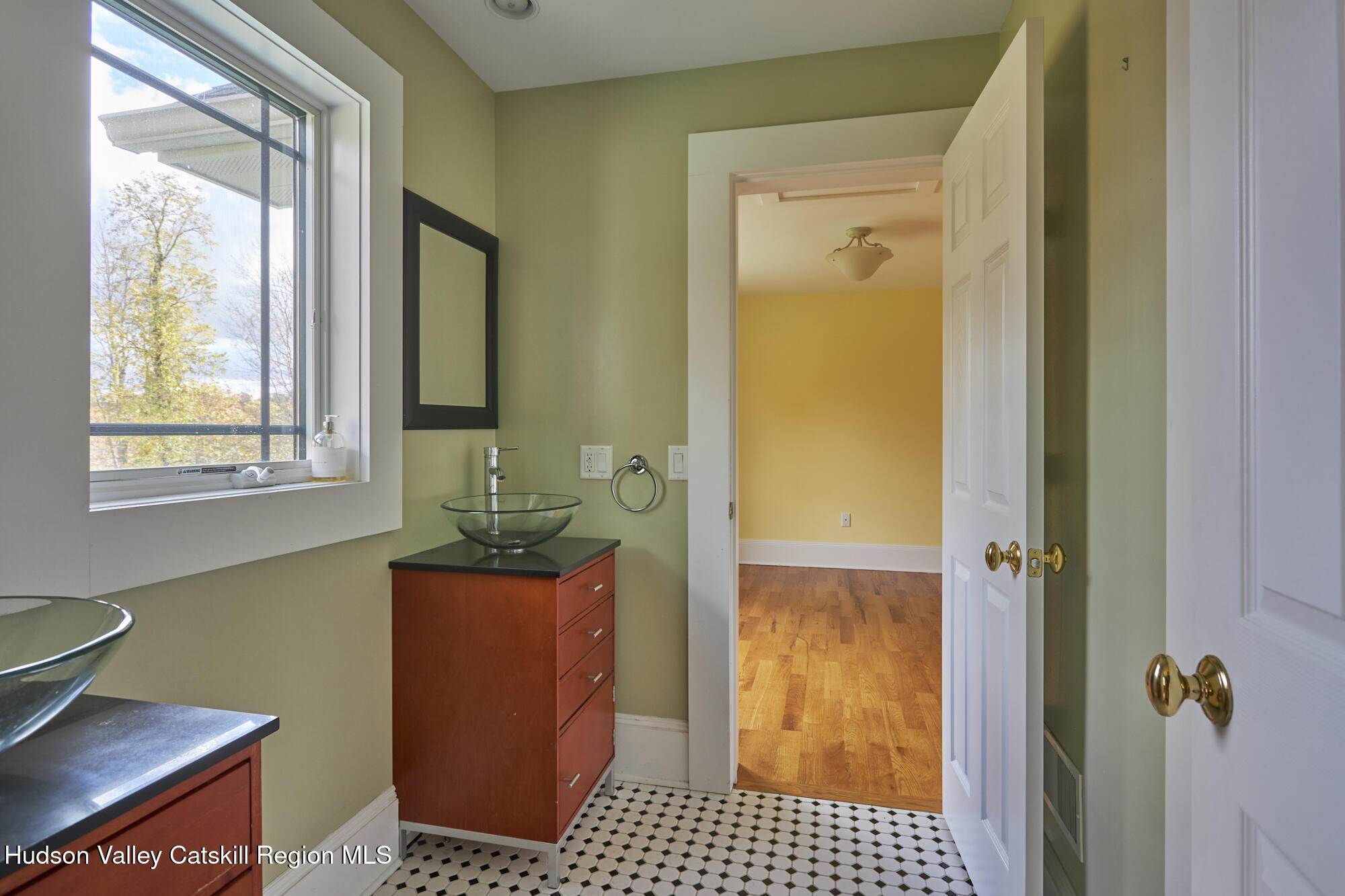203 Silver Lake Road Rhinebeck, NY 12572 - Photo 28 of 46 a bathroom with a sink a window and shower