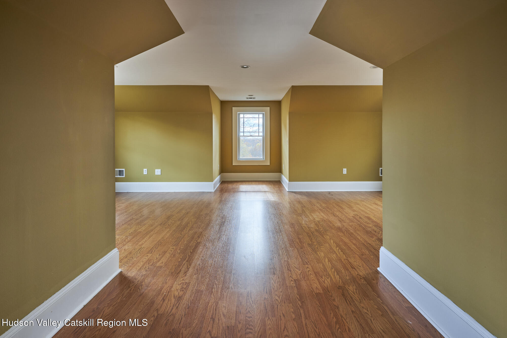 203 Silver Lake Road Rhinebeck, NY 12572 - Photo 30 of 46 a view of an empty room with wooden floor and a window