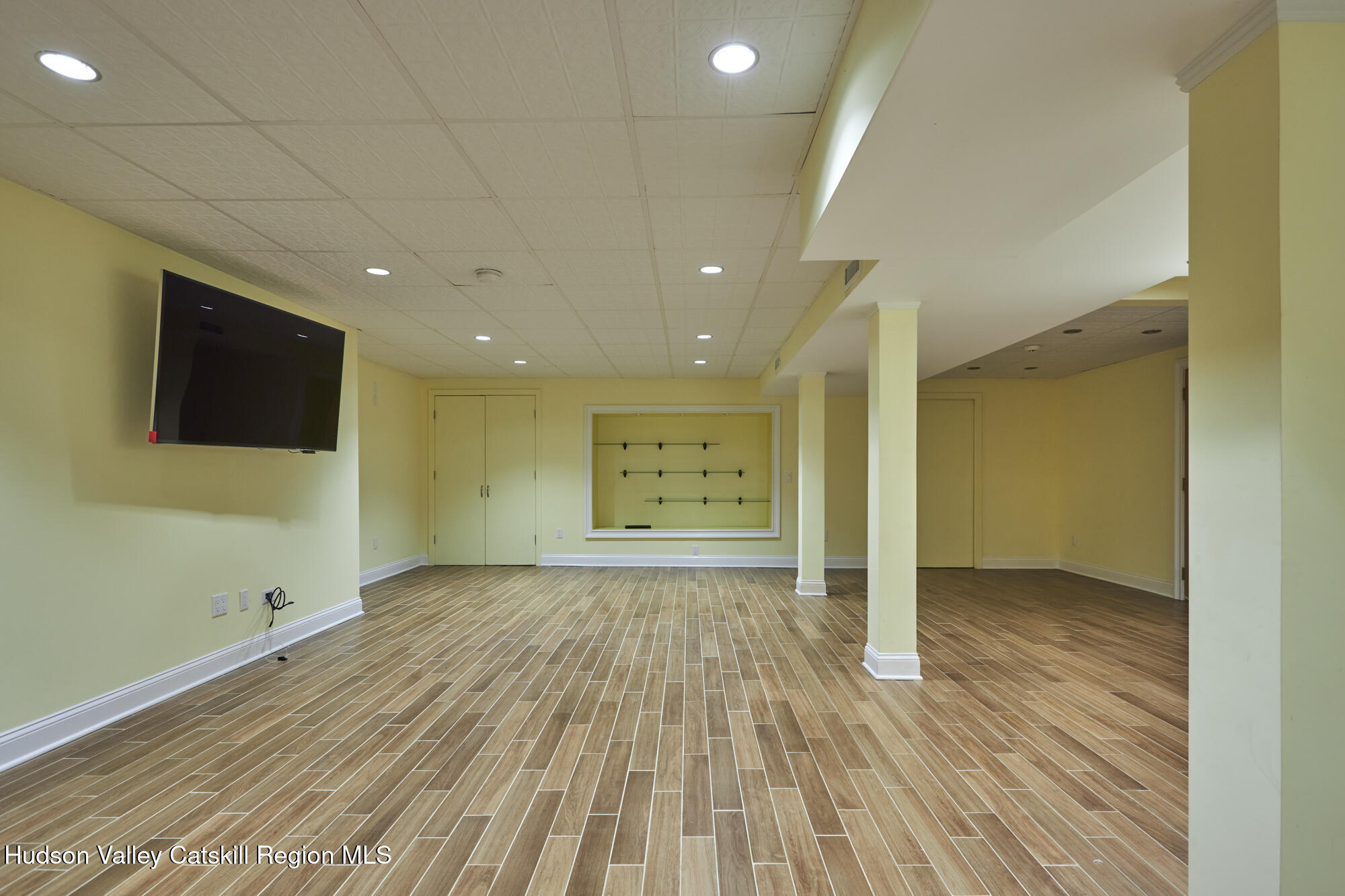 203 Silver Lake Road Rhinebeck, NY 12572 - Photo 32 of 46 a view of an empty room with wooden floor and a window