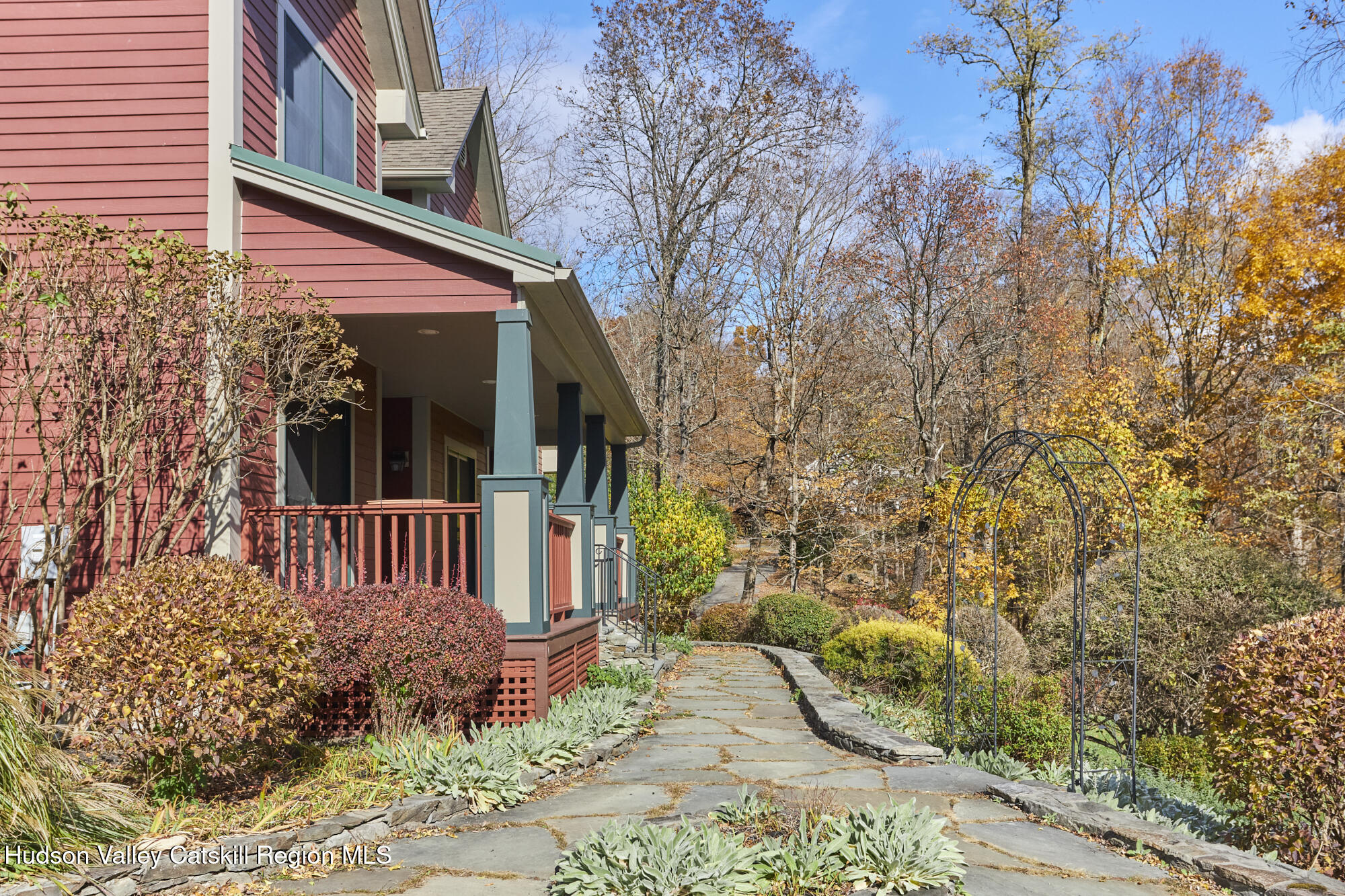 203 Silver Lake Road Rhinebeck, NY 12572 - Photo 36 of 46 a view of a house with a small yard and wooden fence