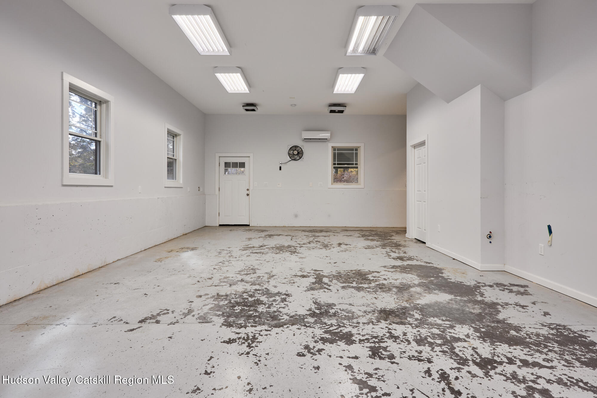 203 Silver Lake Road Rhinebeck, NY 12572 - Photo 41 of 46 a view of a big room with window and refrigerator