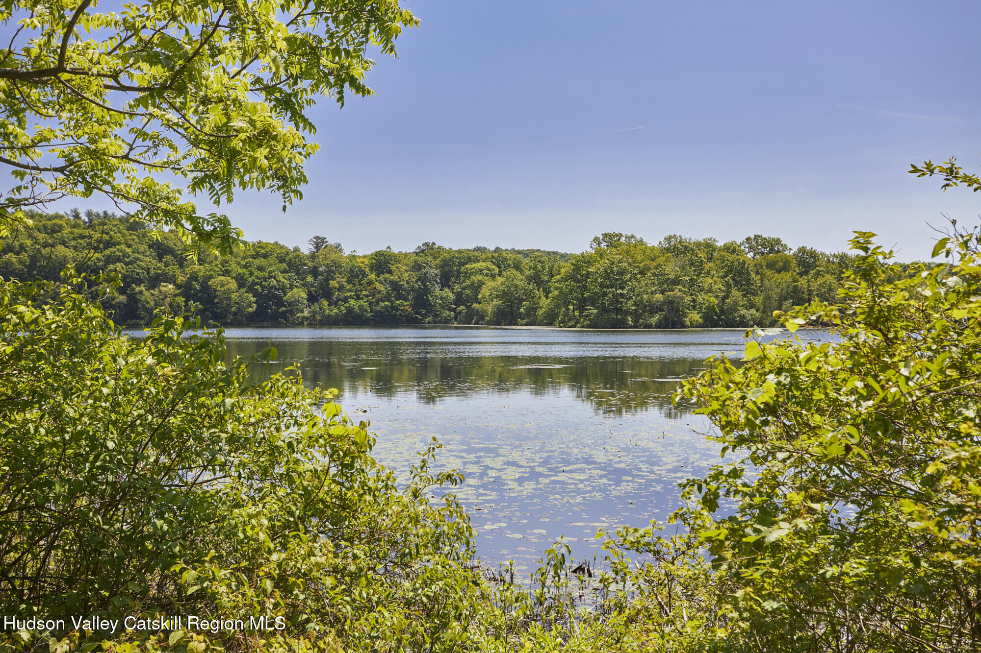 203 Silver Lake Road Rhinebeck, NY 12572 - Photo 46 of 46 a view of a lake with a house in the background