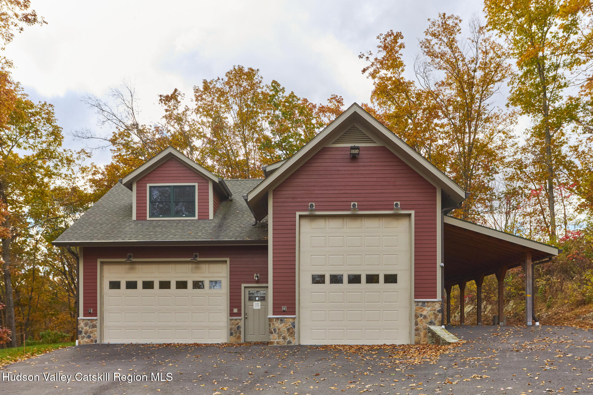 203 Silver Lake Road Rhinebeck, NY 12572 - Photo 5 of 46 a front view of a house with a yard and garage