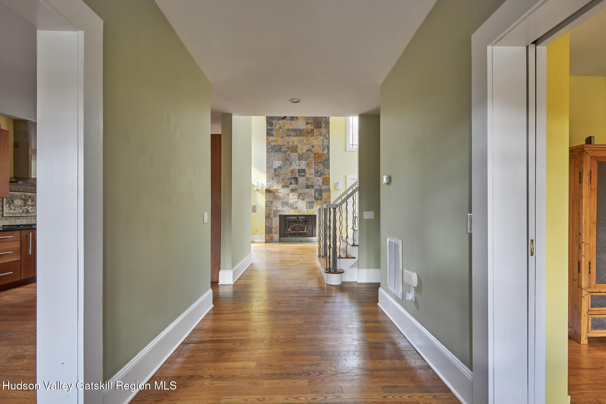 203 Silver Lake Road Rhinebeck, NY 12572 - Photo 10 of 46 a view of a hallway with wooden floor and windows