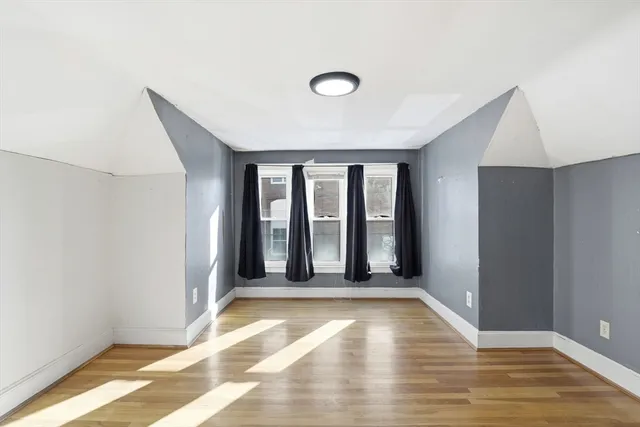 a view of an empty room with glass door