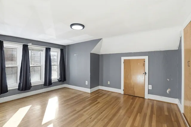 wooden floor and windows in an empty room