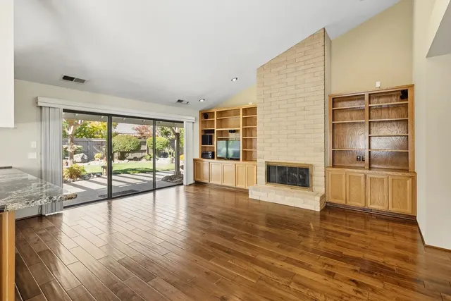 a open kitchen with stainless steel appliances granite countertop a sink and cabinets