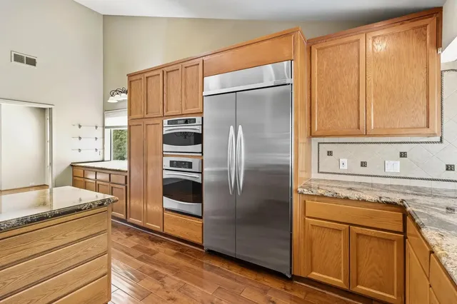 a kitchen with a sink and large window
