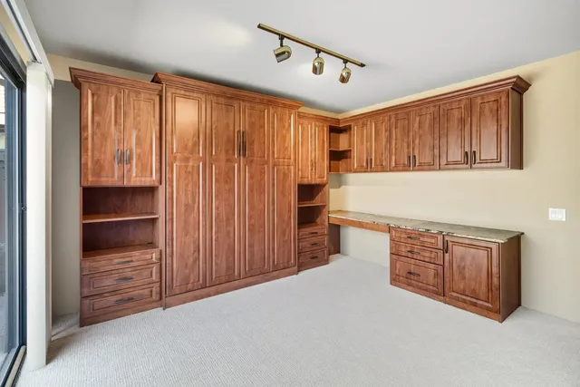 a bathroom with a toilet a sink and shower