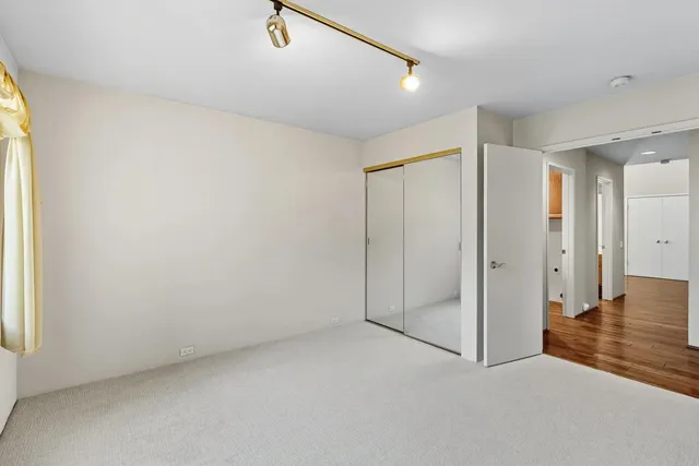 a view of a hallway with closet