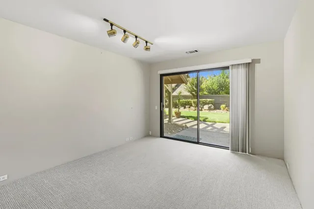 a view of entryway with wooden floor and stairs