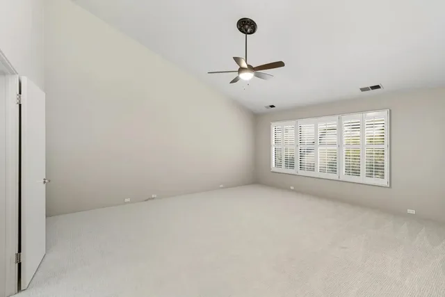 a bathroom with a double vanity sink and mirror with shower