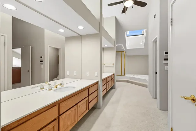 a view of a porch with chairs and potted plants