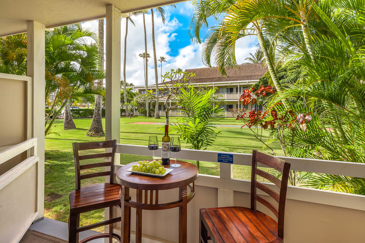 525 Aleka Loop, Unit E3 Kapaa, HI 96746 - Photo 2 of 23 a view of a chairs and table in patio
