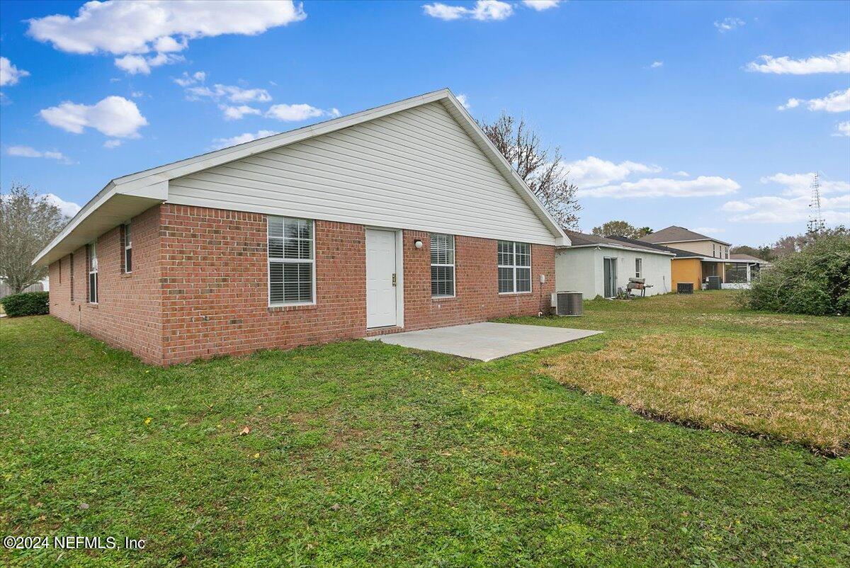 7133 High Bluff Road Jacksonville, FL 32244 - Photo 15 of 17 a view of a house with backyard