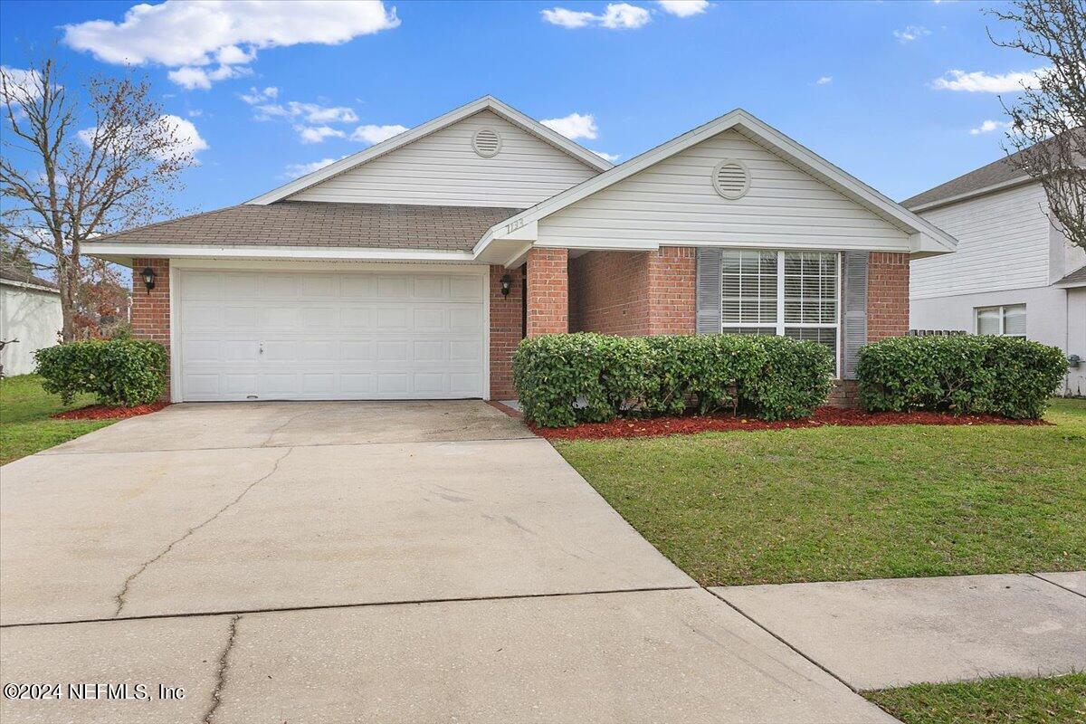 7133 High Bluff Road Jacksonville, FL 32244 - Photo 17 of 17 a front view of a house with a yard