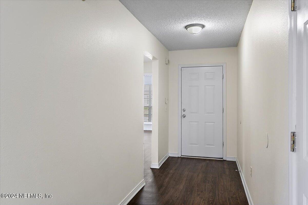 7133 High Bluff Road Jacksonville, FL 32244 - Photo 2 of 17 a view of hallway with wooden floor
