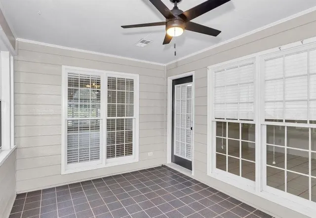 a view of empty room with windows