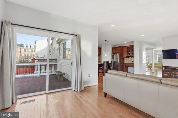 a view of a living room and a large window