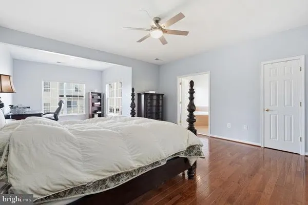 a bed room with a bed and a chandelier