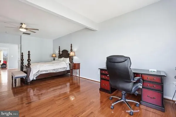a bedroom with a bed and a chair