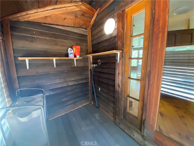 a bed room with a bed mirror and a balcony