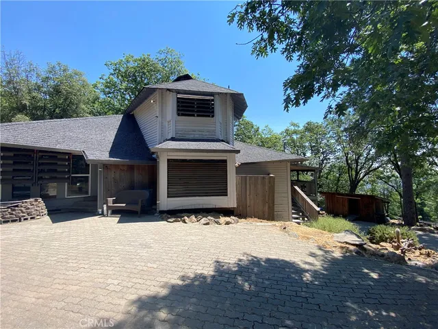 a view of a house with a yard and garage