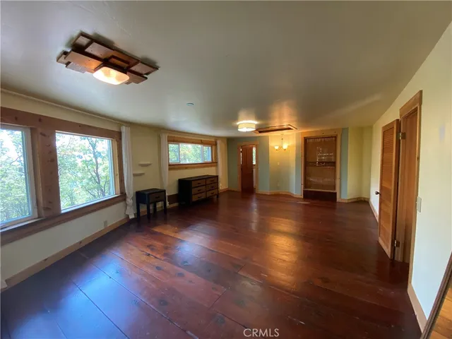 a bathroom with a granite countertop toilet sink and mirror