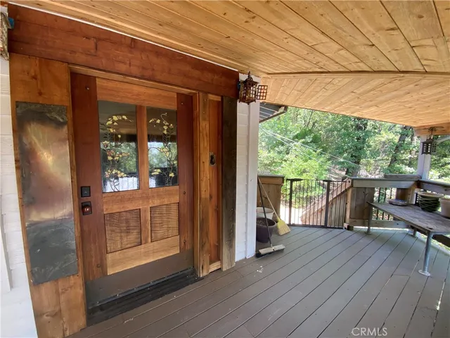 a view of house with porch and wooden floor