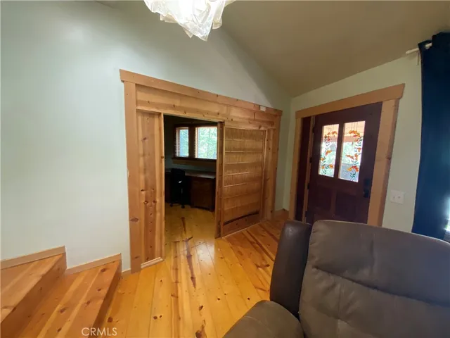 a room with bed and mirror