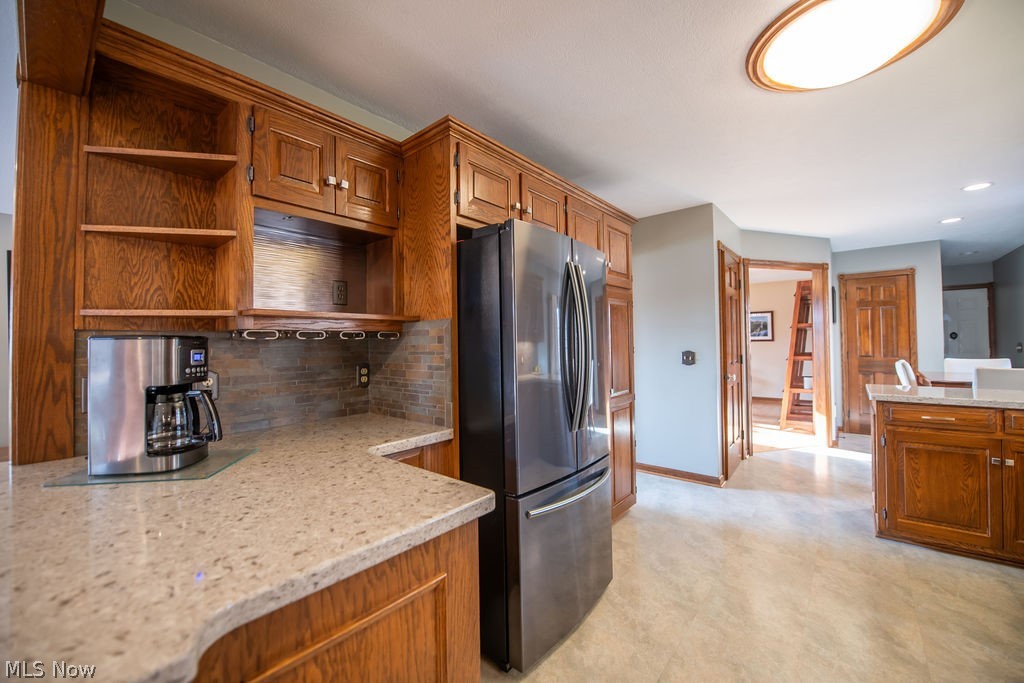 4848 Fette Road Dennison, OH 44621 - Photo 19 of 48 Kitchen with spacious countertops, wood cabinetry, and recessed lighting