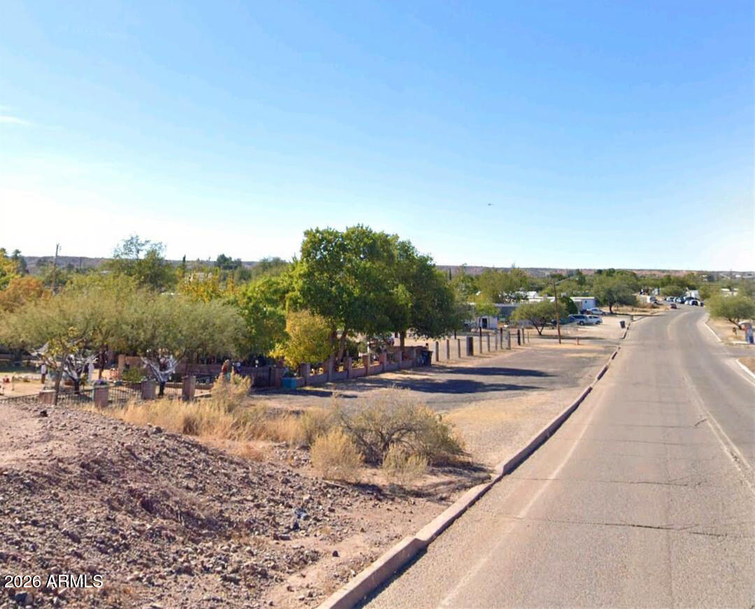455 East Mark Street Benson, AZ 85602 - Photo 6 of 13 a view of a swimming pool and a yard